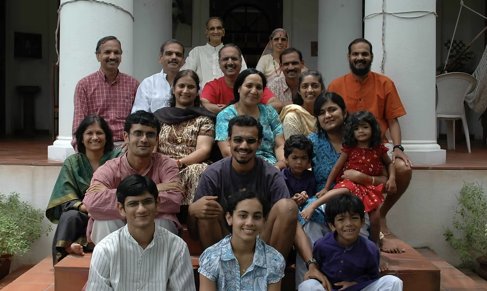 Three generations of the Ama La Vida family on the steps of the residence